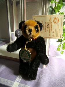 Miniatur Panda "Pollux", braun schwarz, Zertifikat
